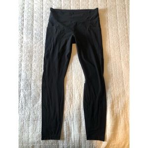 Athleta leggings with stash pocket and laser cut